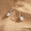 Twisted bar earrings adorned with pearls