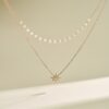 Silver necklace with stylized small pearl chain