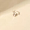Ring with open design and round moonstone accent
